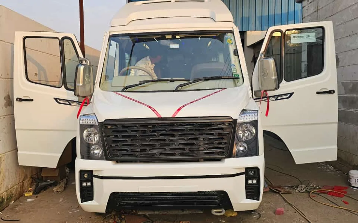 A 17-seater tempo traveller of the kind used for Varanasi local sightseeing packages